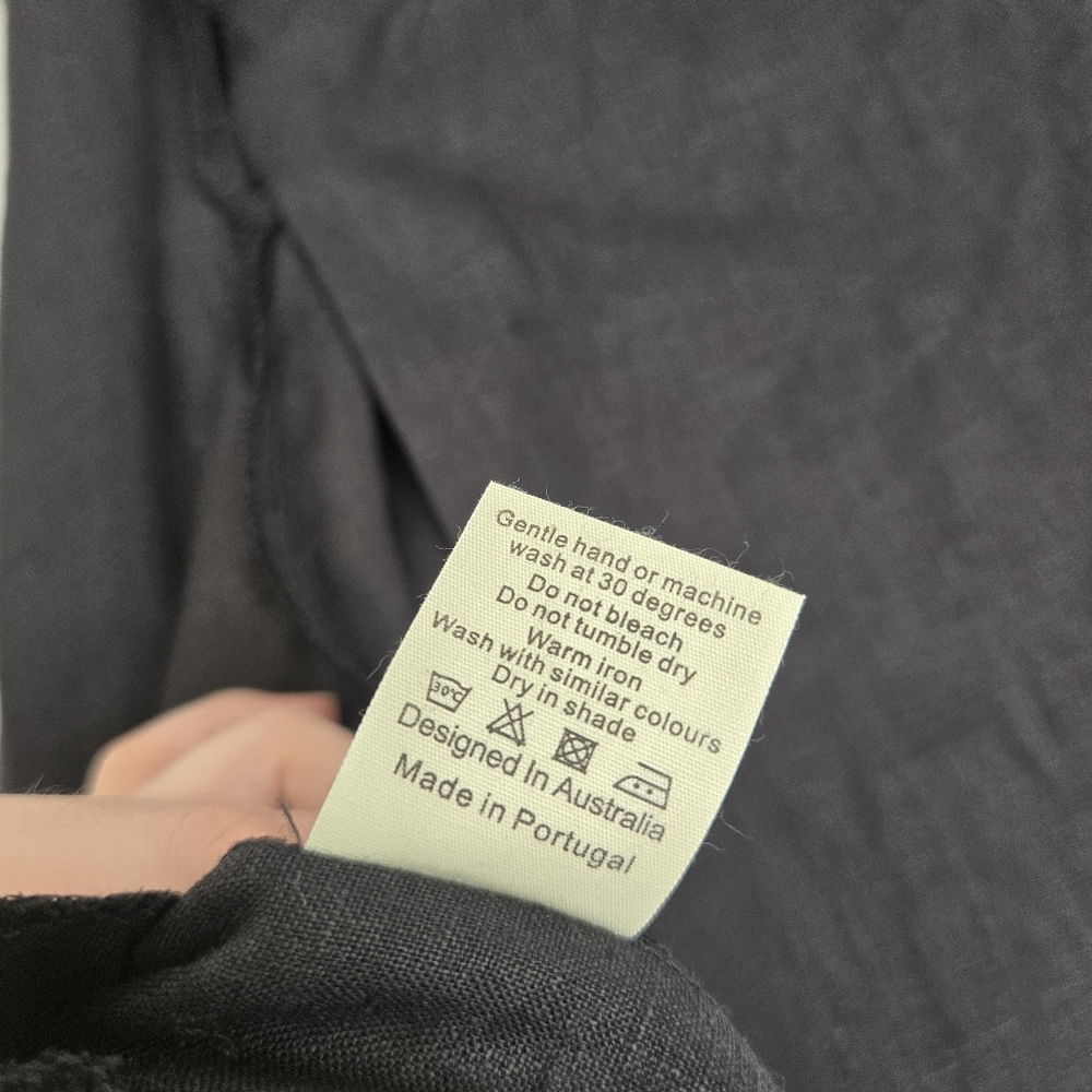 Sleeveless Black Asymmetrical Wrap Dress - Picture 12 of 13